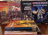 Lot shows stack of assorted Warhammer and related wargaming magazines and books including Warhammer Battle for a Skull Pass, Warhammer Armies of Antiquity, Warhammer 40,000 Assault on Black Reach, and Space Hulk Mission Book.
