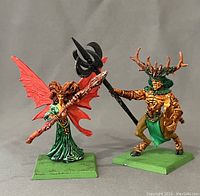 Two hand painted Warhammer wood elf figurines of Orion and Ariel on green bases showing front and side views