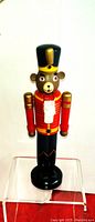 Single Nutcracker Teddy Bear Soldier figurine, standing 6 inches tall, painted in red, black, gold, and white.