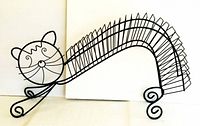 Large painted metal cat-shaped CD holder with wire slots for over 25 CDs