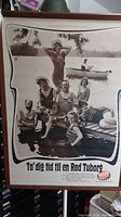 Full photo of framed Dutch beer advertisement poster showing a group of six people by a lake in vintage swimwear with Red Tuborg beer bottles and Danish text.