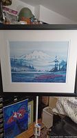 Full view of the framed and matted art print showing the mountain and forest landscape scene.