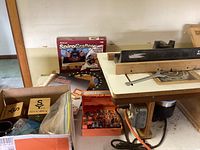Overall view of the router table setup, box of router bits, SpiroCrafter pattern kit, manuals and templates