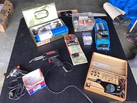 Full lot overview showing Benzomatic kit, riveter kits, soldering iron, glue gun, rivets, and Vibro tool