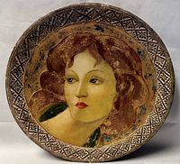 Full frontal view of the 18-inch Florentine wall charger depicting a Botticelli-style painted female portrait with floral motifs on rim.