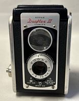 Front view of the Kodak Duaflex III camera showing the lenses, exposure settings, and branding.
