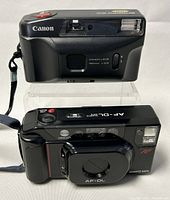 Both Canon Snappy EZ and Minolta AF-DL cameras shown together showing front and top views.