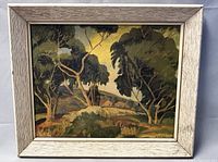 Full view of framed oil painting showing the landscape scene with trees and hills in natural colors and visible signature.
