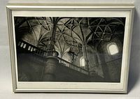 Overall view of the framed photogravure showing architectural interior, silver frame with minor wear