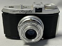 Front view showing Steinheil Munchen Cassar 50mm f/3.5 lens with Prontor-S shutter, Regula King script on top plate, and black textured body covering.