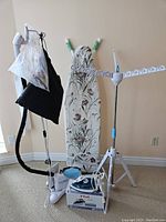 Full lot showing ironing board, Tobie steamer, T-Fal iron with box, and drying rack