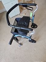 Overhead view of rollator showing padded seat, handlebars and front wheels
