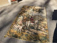 Full view of the tapestry laid flat outdoors showing size, colors, and overall design.