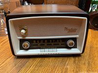 Front view of Nordmende Sterling Norma Luxus radio showing wooden cabinet and front panel