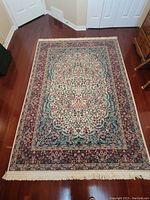 Overall view of the Cairo area rug on hardwood floor