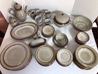 Full set of Ceramano West Germany stoneware including various plates, bowls, cups, saucers, coffee pot, serving pieces, and condiments.