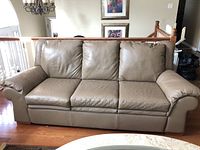 Front view of the full sofa showing three-seat configuration and rolled arms