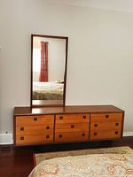 Full view of teak dresser with mirror mounted