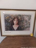 Framed print of young girl titled "Jasmine" showing full frame, numbered 19/500 and signed by Bannister.