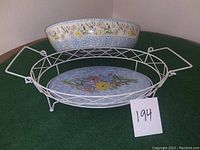 Oval ceramic baking dish with spring floral pattern shown from top and side angle.