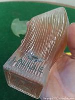 Front view of the bottle showing 'Lalique' branding on the bottom.