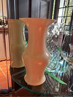 Porcelain vase with smooth cream finish shown from front view
