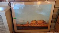 Front view of Edgar Payne framed print showing desert mesa landscape with blue sky, warm reddish-brown earth tones, framed with a dark frame and cream matte.