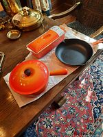 All three items displayed together: round saucepan with lid, rectangular casserole with lid, and frying pan