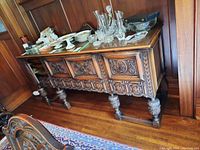 Front view of sideboard with assorted items on top