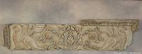 Full-length view of plaster frieze showing entire 15×60 form with griffin figures at each end
