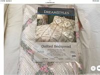 Packaged DreamStyles quilted twin bedspread with floral and diamond pattern design visible through packaging.