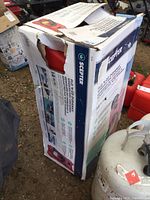 Photo of Scepter branded box showing the new fuel container inside with some box damage