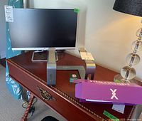 Full view showing HP monitor on Nulaxy aluminum laptop stand, Plexicam box nearby