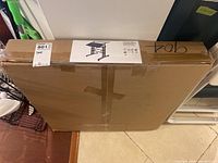 Factory sealed desk box with small label showing model and brand information.