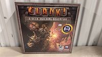 Front of Clank! board game box showing artwork and title.