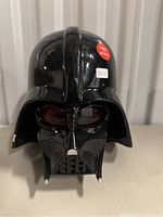 Front view of the Darth Vader helmet with visible light and sound sticker and price tag
