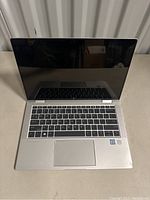 Front view of opened laptop showing keyboard and display