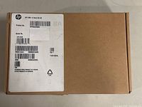 Closed cardboard box labeled with HP USB-C Dock G4 US product information and barcode sticker, date 11/01/2018 visible.