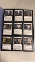 A binder page with nine Magic: The Gathering cards: Unseen, Unseen, Soul Ascendant, Sunny Silence, Inner Reckoning, Inner Reckoning, Sunny Silence, Giant Honored Monk, Giant Honored Monk.