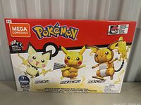 Photo of the Mega Construx Pokemon Pikachu Evolution Trio box showing Pichu, Pikachu, Raichu figures and set details