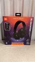 Front view of JBL Quantum 350 wireless headphones retail box showing headphones image and wireless transmitter pocket.