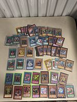 Full spread of approximately 44 cards on table