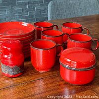 16-piece vintage Thomas tableware set, flame pattern red with brown glazed details: 5 cups, 8 saucers, covered sugar bowl, salt shaker.