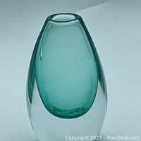 Full side view of the sommerso vase showing the teal inner glass and clear outer layer. Rounded teardrop shape with smooth polished surface.