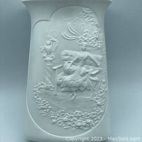 Front view of bisque porcelain vase showing Victorian woman on bench floral relief