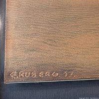 Close-up of signature embossed into the leather panel showing 'E. Ruberg 73'.