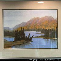 Front view of framed original oil painting showing autumn landscape with water and trees.