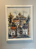 Full view of the framed canvas painting depicting a Quebec street and fortress scene.