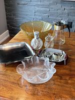 Photo showing all items together: large amber Soreno bowl, Lampe Berger, two chrome trays, ruffled glass bowl, honey dish, Pyrex coffee pot