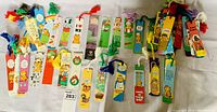 Multiple vintage Garfield bookmarks arrayed showing variety of comic sayings and tassel colors.